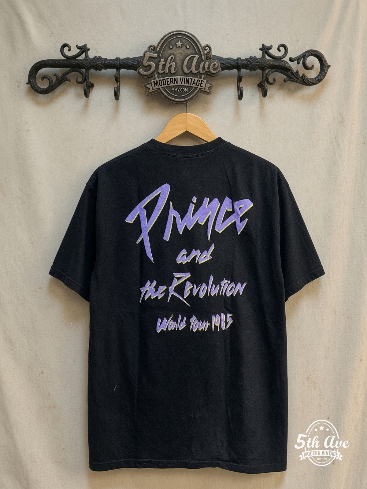 Prince and the Revolution – Vintage Band T-Shirt — back on locked cream ornate 5th Ave rack