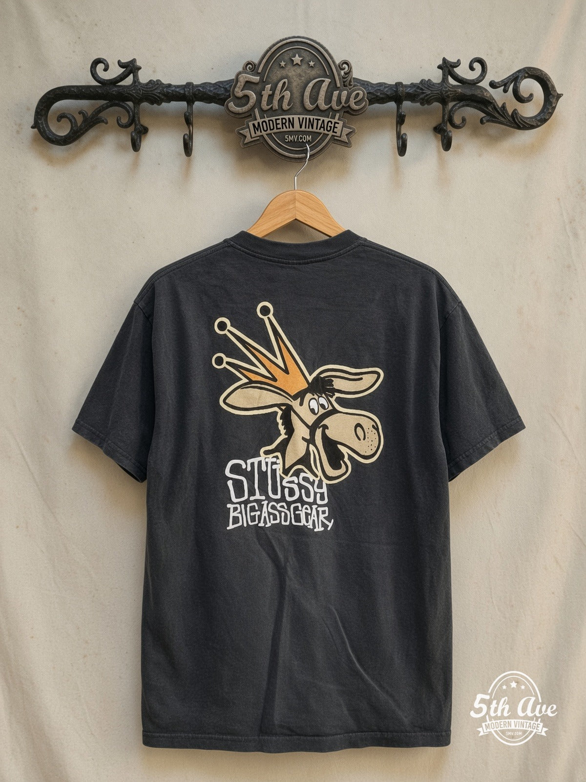 Stussy – Big Ass Gear – Vintage Graphic Tee back on locked cream ornate 5th Ave rack