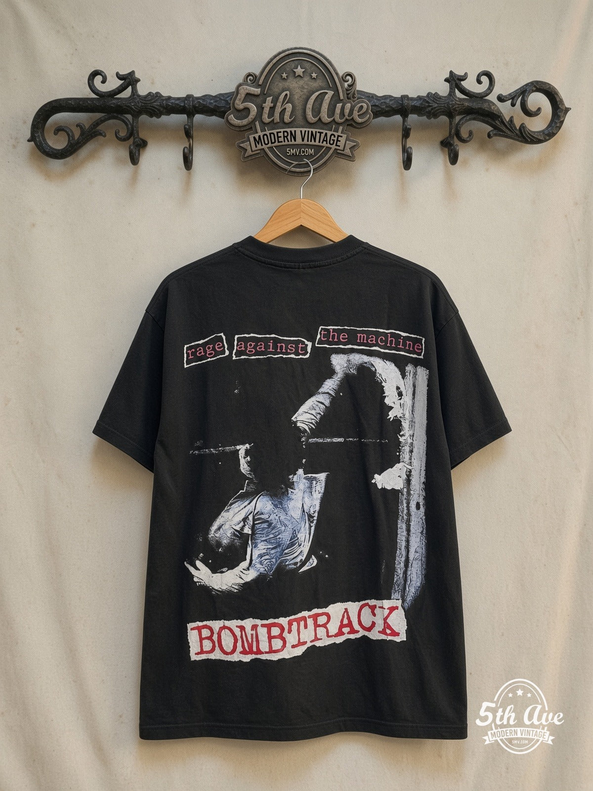 Rage Against the Machine – Bombtrack Red Blue – All Over Print – Vintage Band T-Shirt — back on locked cream ornate 5th Ave rack