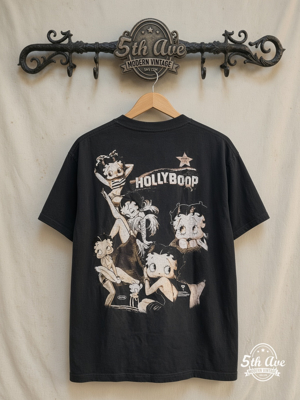 Betty Boop Hollyboop graphic tee in black, back view on a display rack