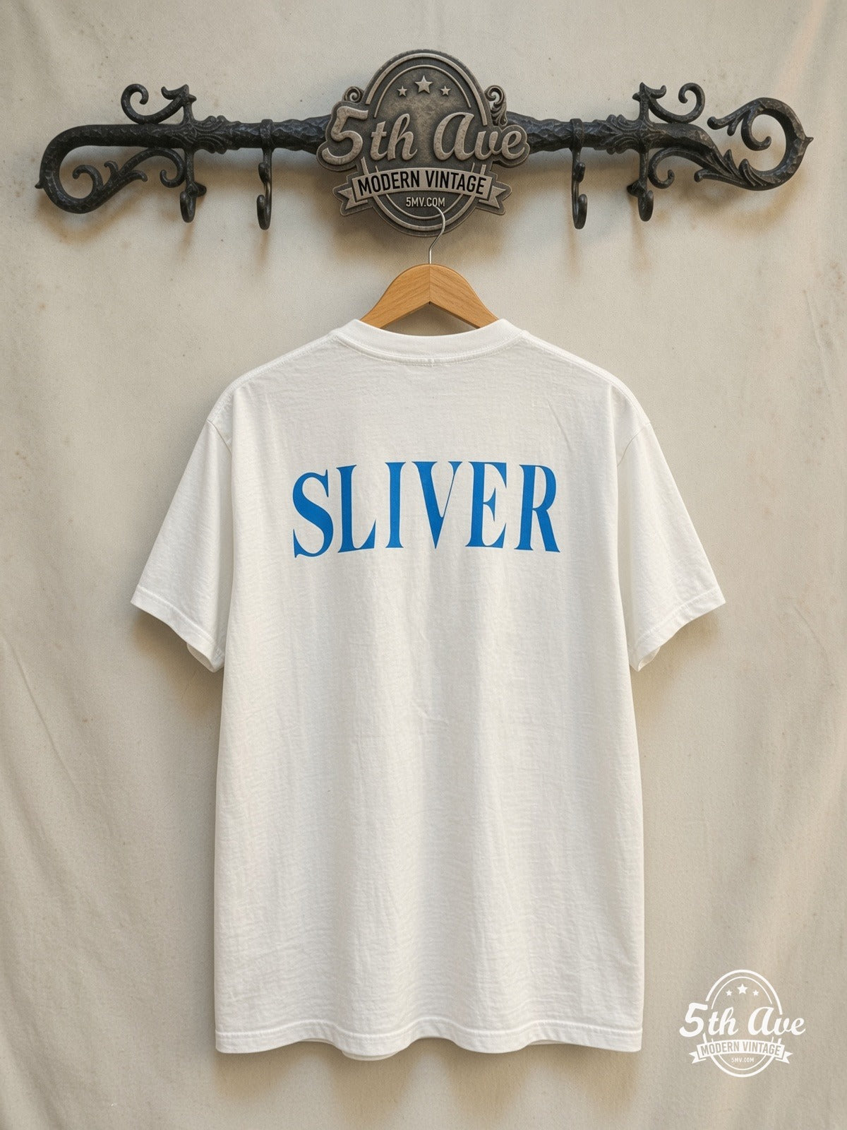 Nirvana – Sliver Spanish Text Anatomical Figure – Vintage Band T-Shirt — back on locked cream ornate 5th Ave rack