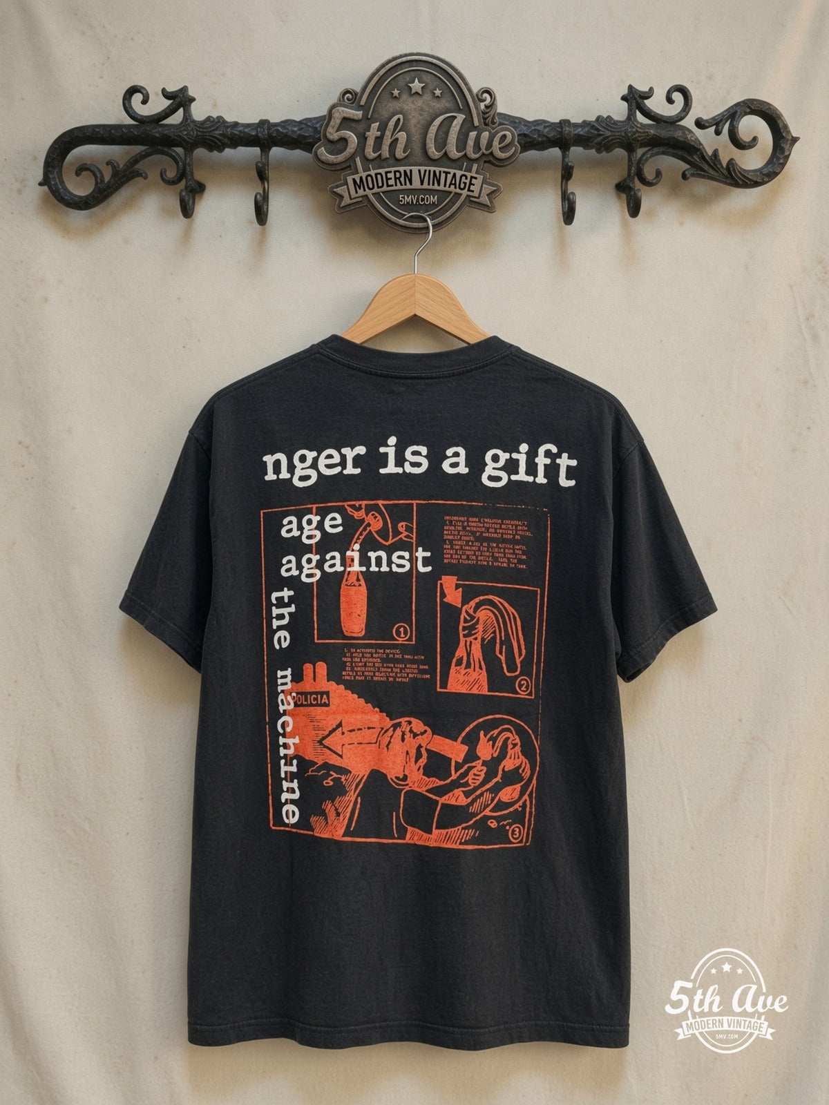 Rage Against the Machine – Anger is a gift – Vintage Band T-Shirt — back on locked cream ornate 5th Ave rack