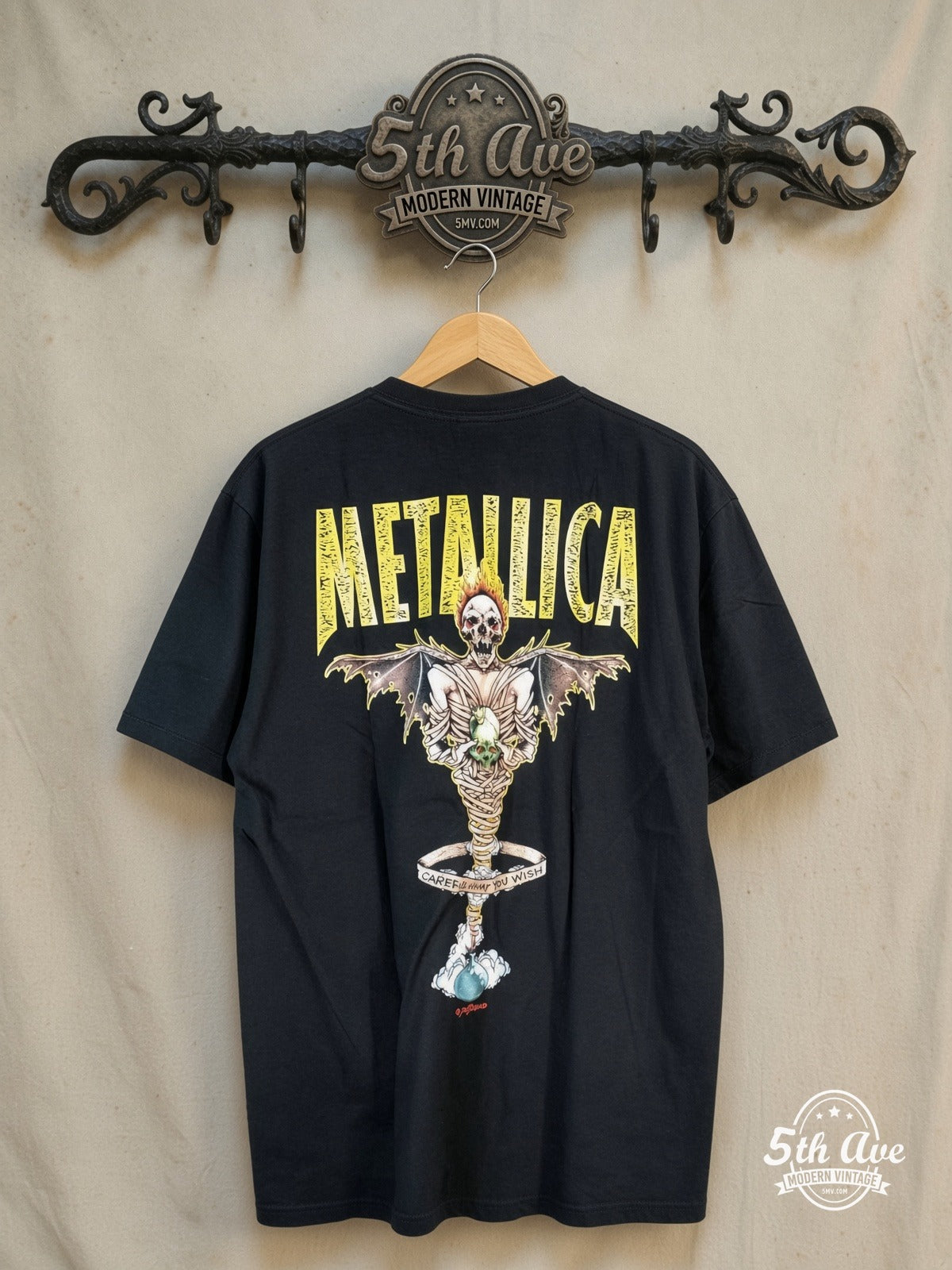 Metallica – King Nothing Fanged Skull Blue Star – Vintage Band T-Shirt — back on locked cream ornate 5th Ave rack