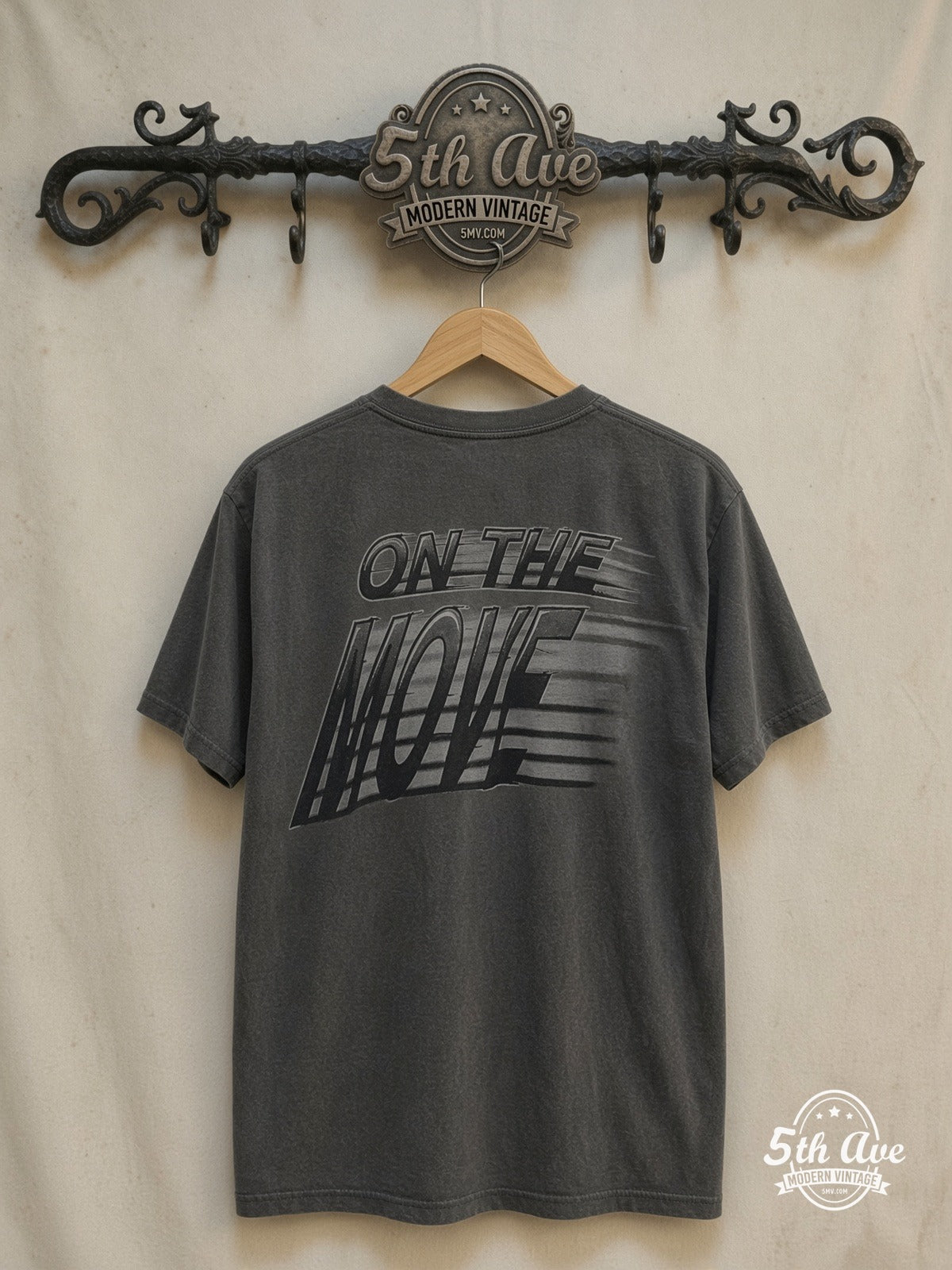 Looney Tunes – On the Move – All Over Print – New Vintage Graphic Tee — back on locked cream ornate 5th Ave rack