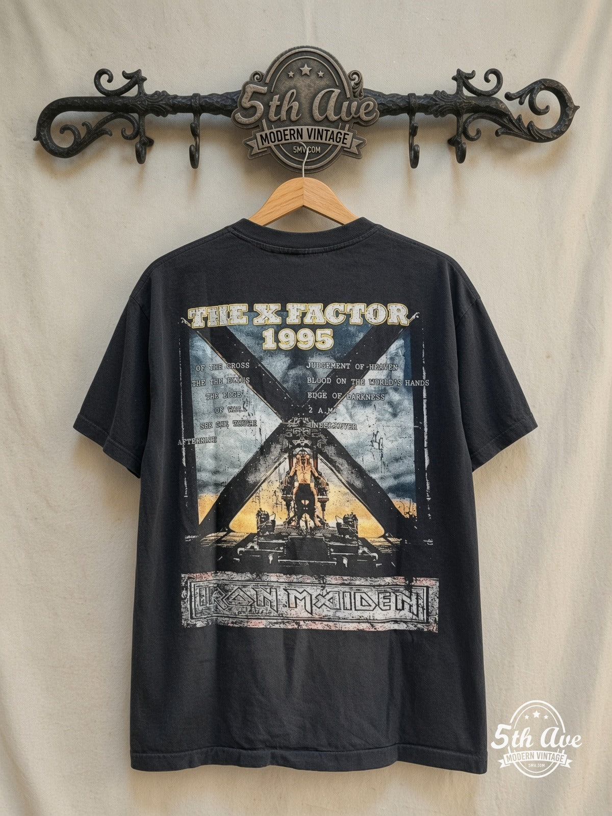 Iron Maiden – The X Factor Tour' 1995 – Vintage Band T-Shirt — back on locked cream ornate 5th Ave rack