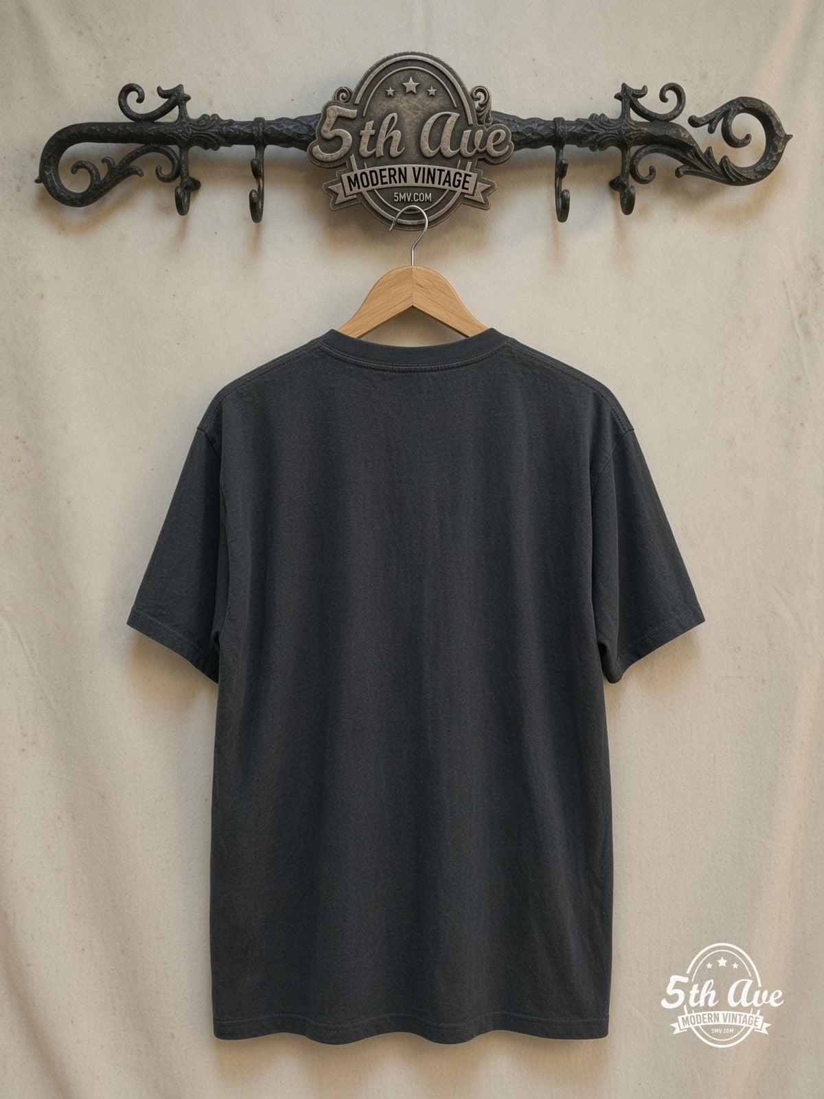 Kurt Cobain / Nirvana – Vintage Band T-Shirt — back on locked cream ornate 5th Ave rack