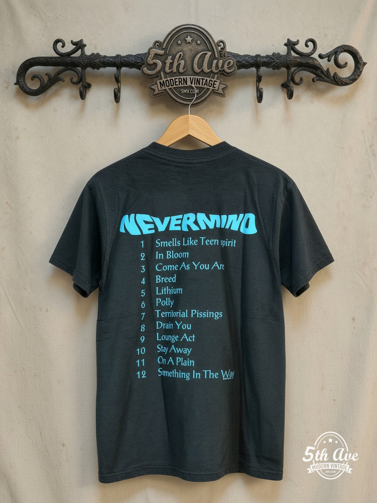 Nirvana – Nevermind Album Art – Vintage Band T-Shirt — back on locked cream ornate 5th Ave rack