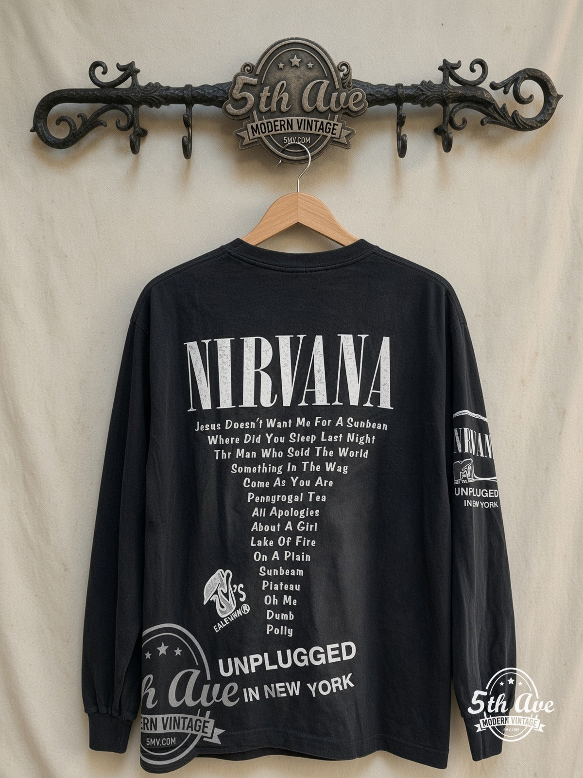 Nirvana – Unplugged' in New York – Vintage Band T-Shirt — back on locked cream ornate 5th Ave rack