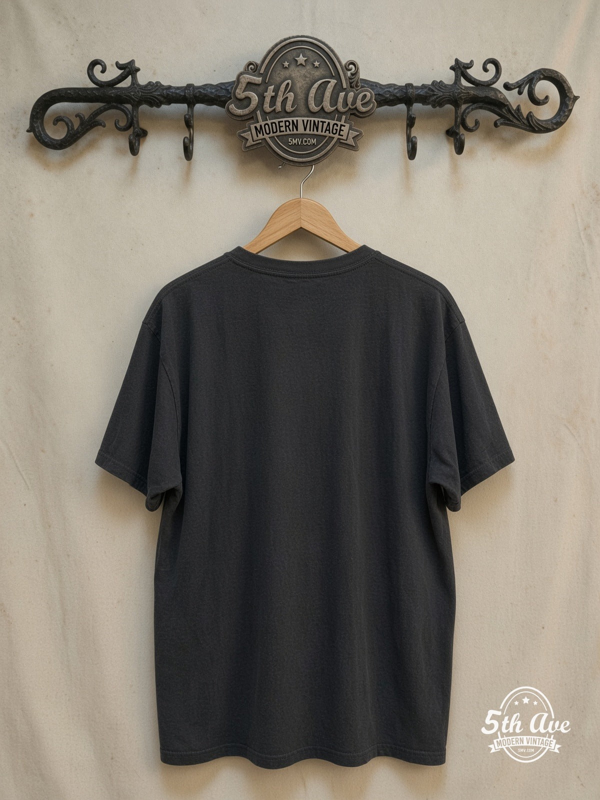 Thin Lizzy – Stacked White Logo Guitarist Silhouette – Vintage Band T-Shirt — back on locked cream ornate 5th Ave rack