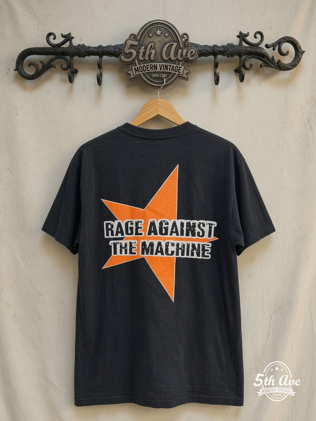 Rage Against the Machine – Evil Empire Boy Orange Star Back – Vintage Band T-Shirt — back on locked cream ornate 5th Ave rack