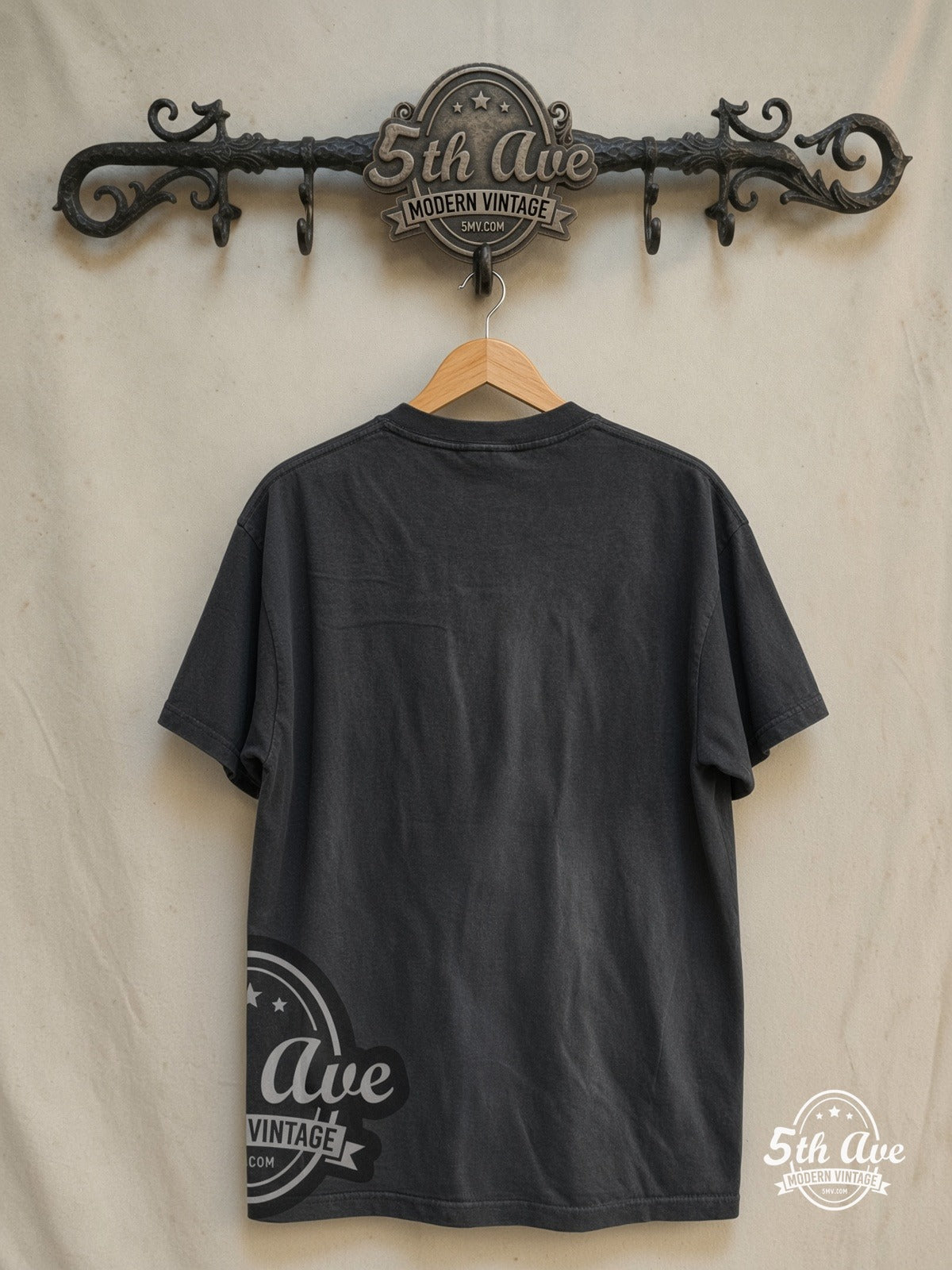 Miles Davis – Trumpeter – Vintage Band T-Shirt — back on locked cream ornate 5th Ave rack