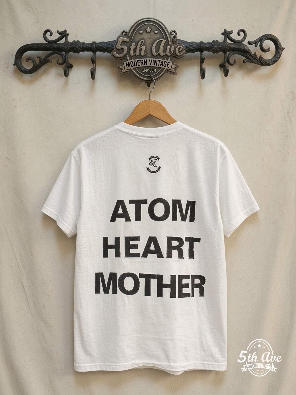 Pink Floyd – Atom Heart Mother Cow Stacked Back – Vintage Band T-Shirt — back on locked cream ornate 5th Ave rack