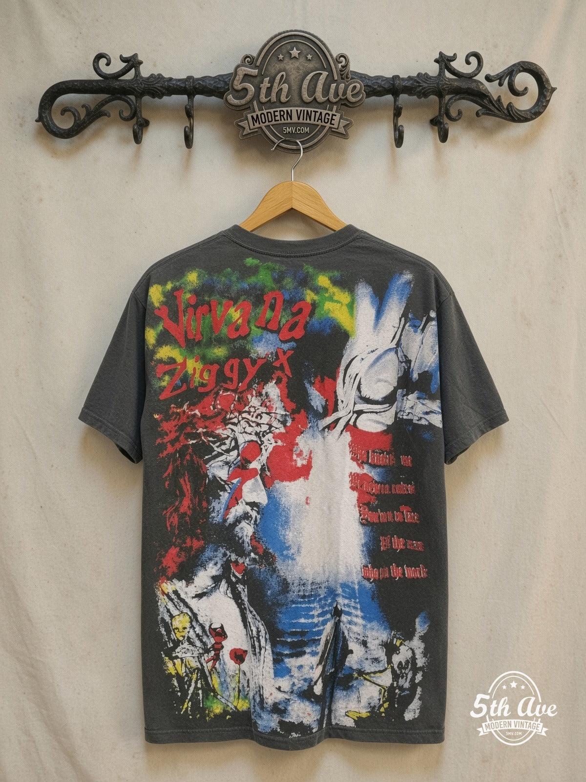 Nirvana – The Man Who Sold the World – All Over Print – Vintage Band T-Shirt — back on locked cream ornate 5th Ave rack