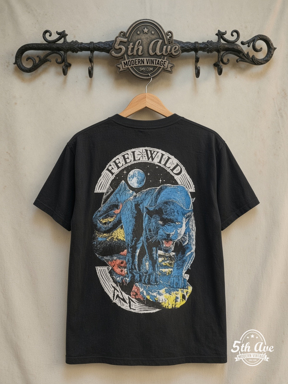 Saint Lucien – FEEL WILD – Vintage Graphic Tee — back on locked cream ornate 5th Ave rack