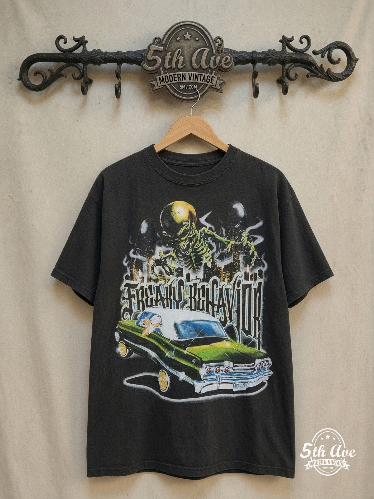 Rollin Hard – Angel de la Guardia Lowrider – Vintage Graphic Tee — back on locked cream ornate 5th Ave rack