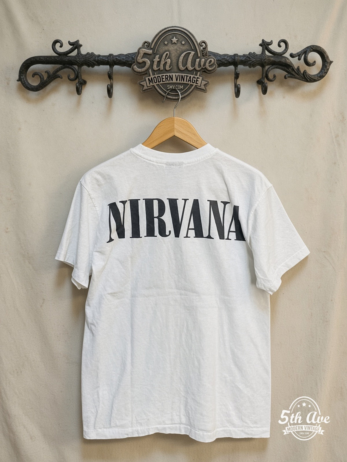 Nirvana – Band Photo Kurt Plaid Portrait – Vintage Band T-Shirt — back on locked cream ornate 5th Ave rack
