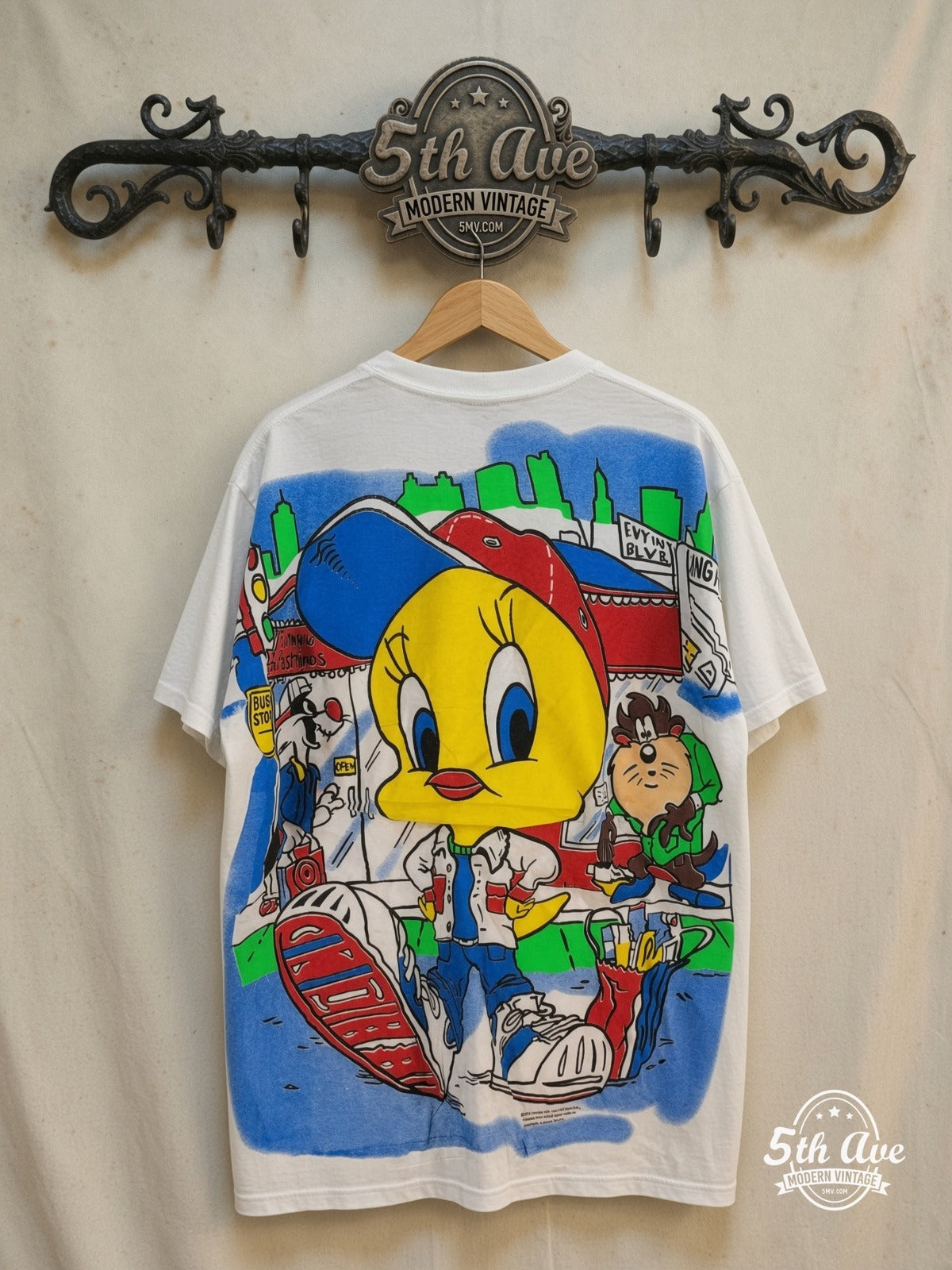Looney Tunes – Tweety, Taz and Sylvester – All Over Print – New Vintage Graphic Tee — back on locked cream ornate 5th Ave rack