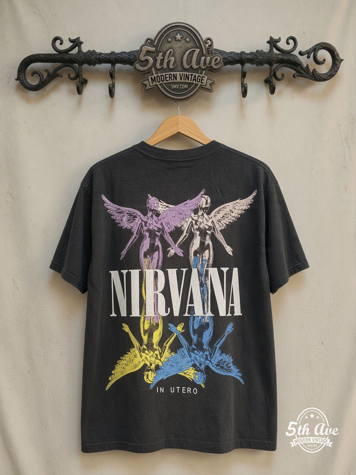 Nirvana – In Utero Colorful Angel – Vintage Band T-Shirt — back on locked cream ornate 5th Ave rack
