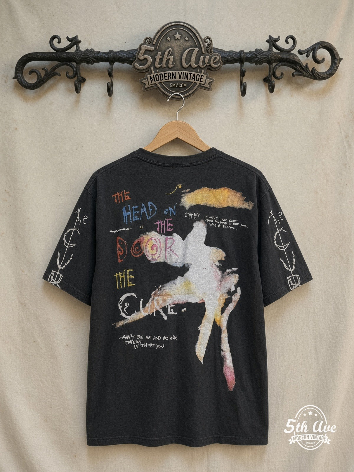 The Cure – The Head on the Door Long Sleeve – Vintage Band T-Shirt — back on locked cream ornate 5th Ave rack