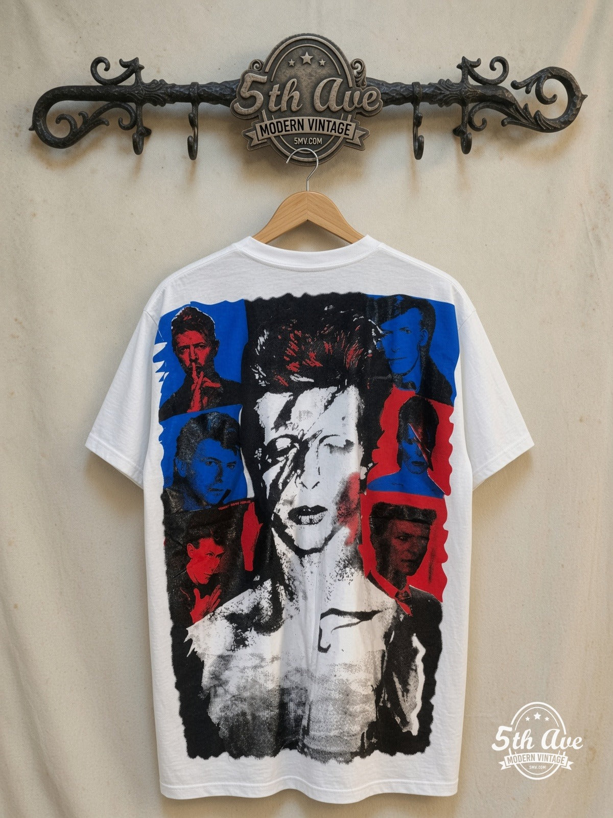 David Bowie – Bowie Melodies Collage – All Over Print – Vintage Band T-Shirt — back on locked cream ornate 5th Ave rack