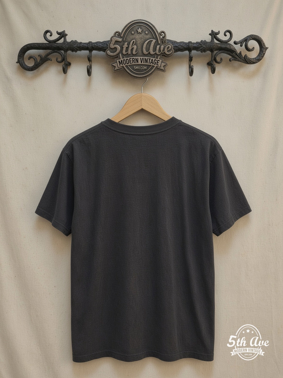 Leonard Cohen – Inspired Portrait Cotton – Vintage Band T-Shirt — back on locked cream ornate 5th Ave rack