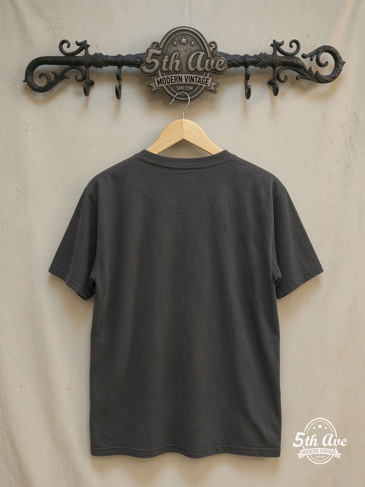 THE CLASH 100% Cotton New Vintage Band T-Shirt – Vintage Band T-Shirt — back on locked cream ornate 5th Ave rack