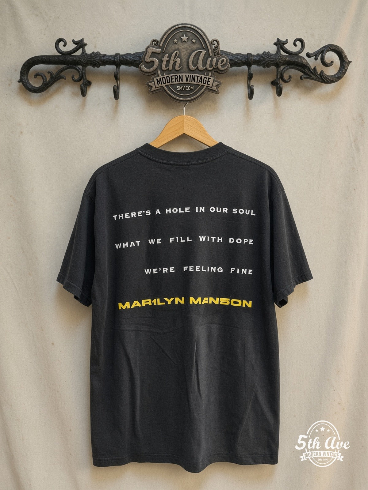 Marilyn Manson 'I Don't Like the Drugs' (But the Drugs Like Me) – Vintage Band T-Shirt — back on locked cream ornate 5th Ave rack