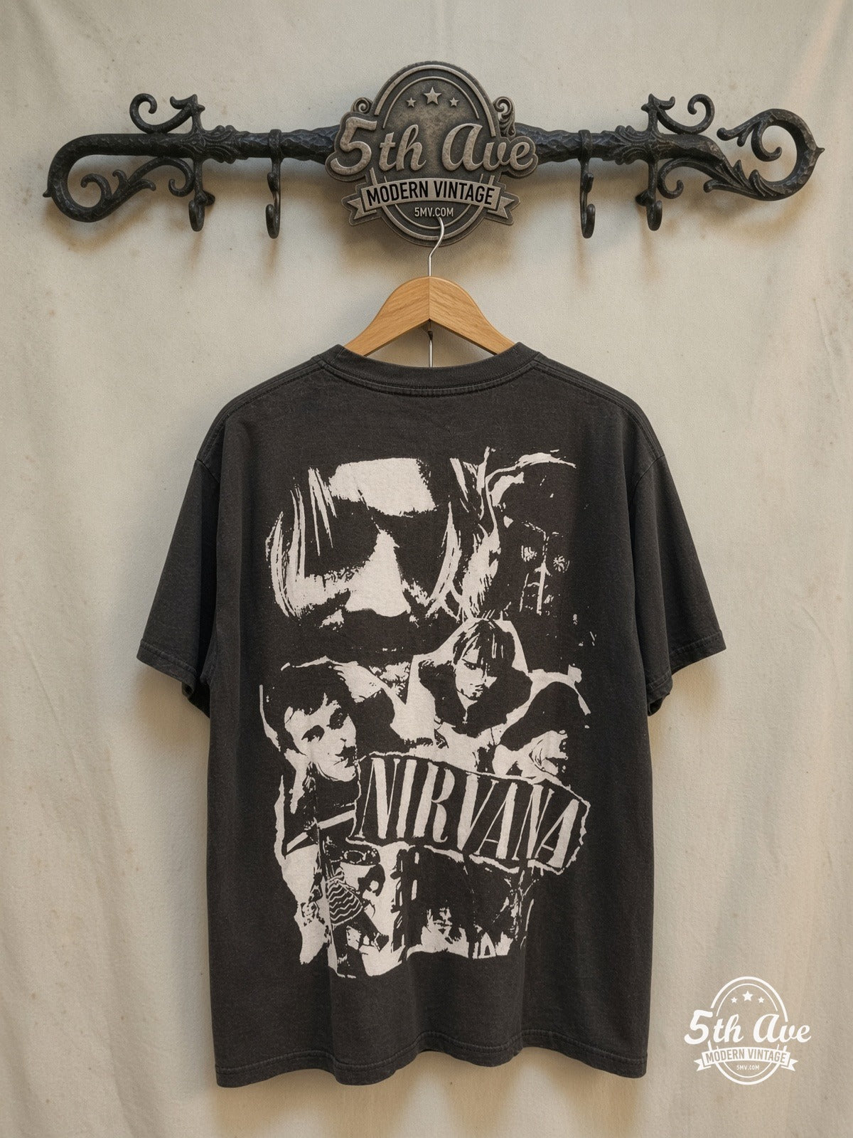 Nirvana – Bootleg Portrait – Vintage Band T-Shirt — back on locked cream ornate 5th Ave rack