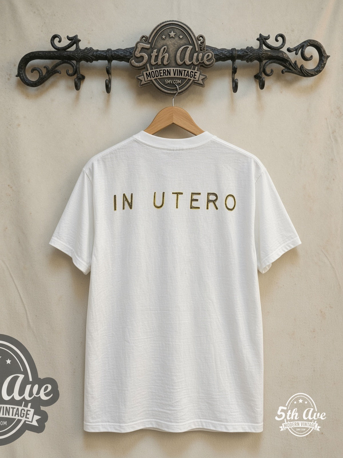 Nirvana – In Utero Yellow Logo Angel Back Print – Vintage Band T-Shirt — back on locked cream ornate 5th Ave rack