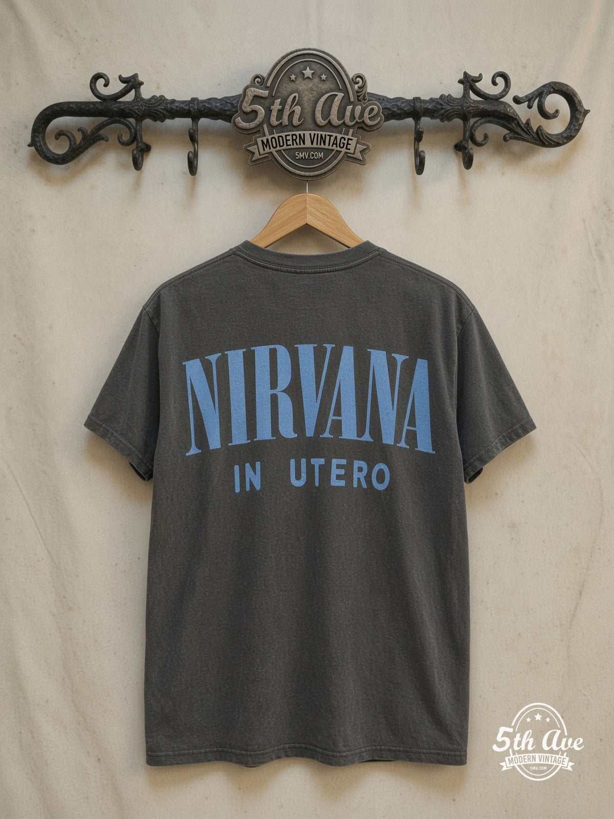Nirvana – In Utero Blue Logo Angel White Tee – Vintage Band T-Shirt — back on locked cream ornate 5th Ave rack