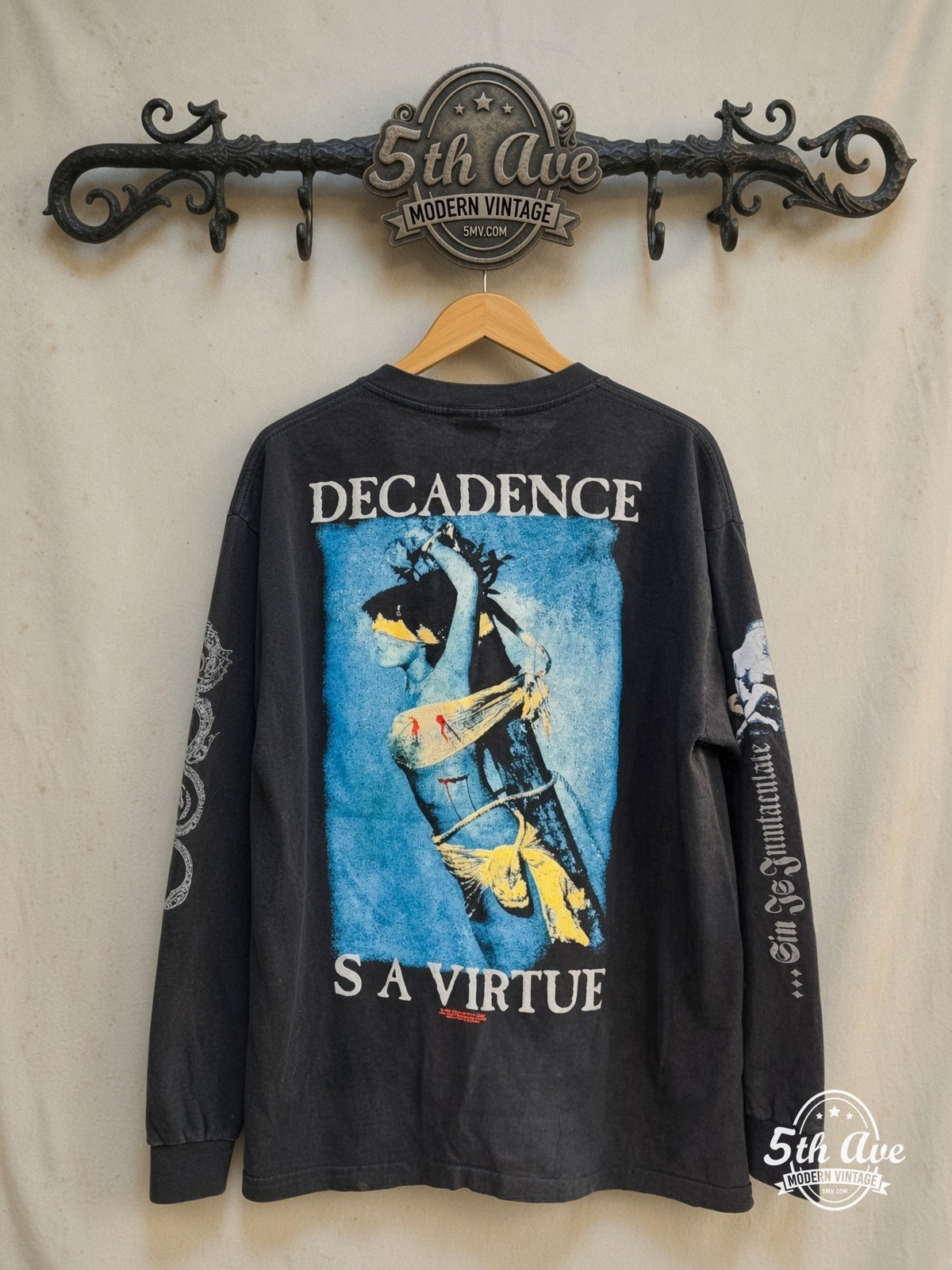 Cradle of Filth – Decadence Is a Virtue – Vintage Band T-Shirt — back on locked cream ornate 5th Ave rack