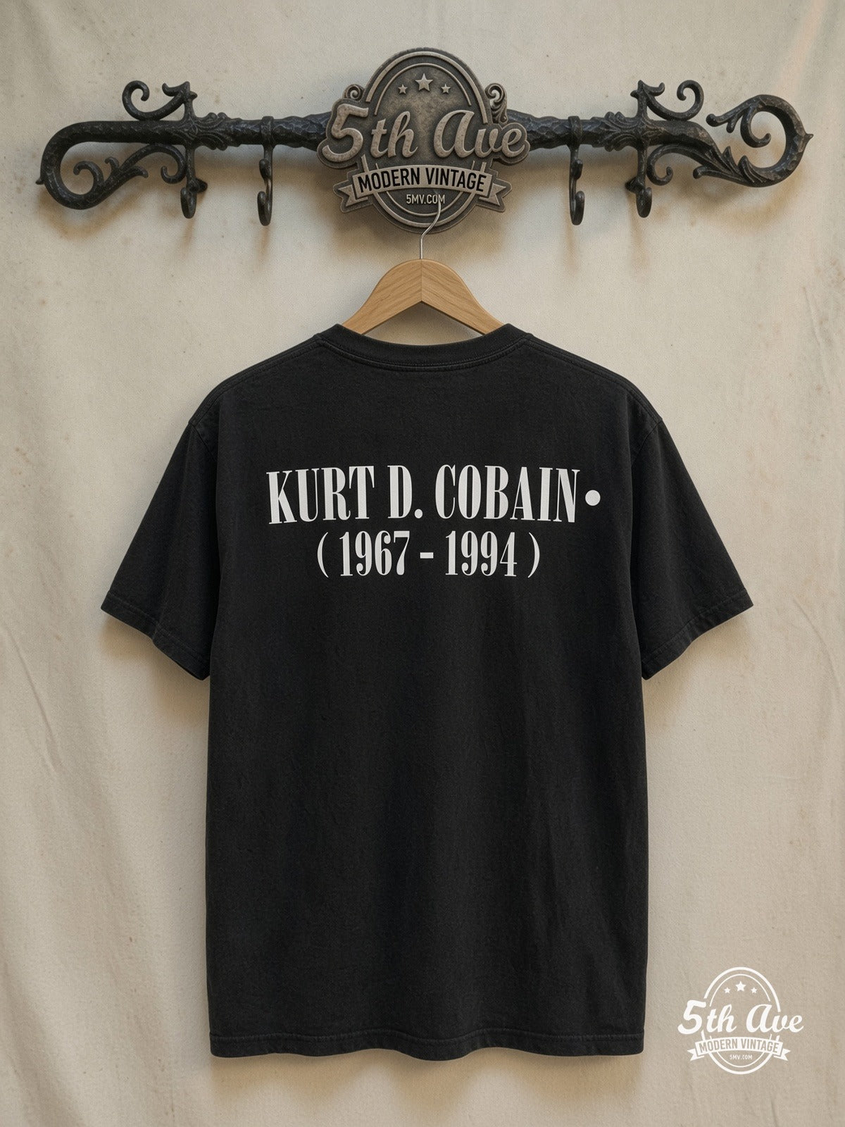 Kurt Cobain – Grunge Tribute – Vintage Band T-Shirt — back on locked cream ornate 5th Ave rack