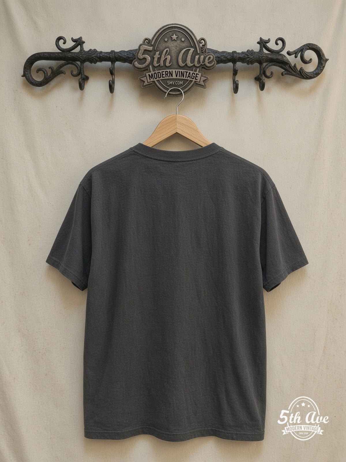 U2 – Vintage Band T-Shirt — back on locked cream ornate 5th Ave rack
