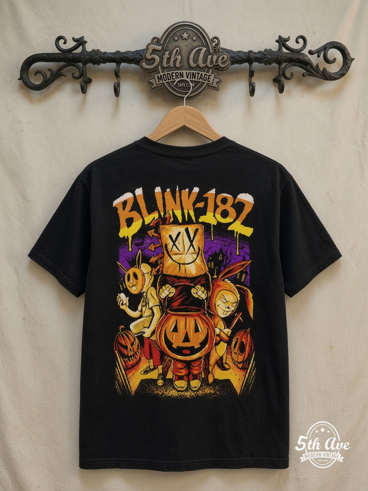 Blink-182 – Halloween Pumpkin – Vintage Band T-Shirt — back on locked cream ornate 5th Ave rack