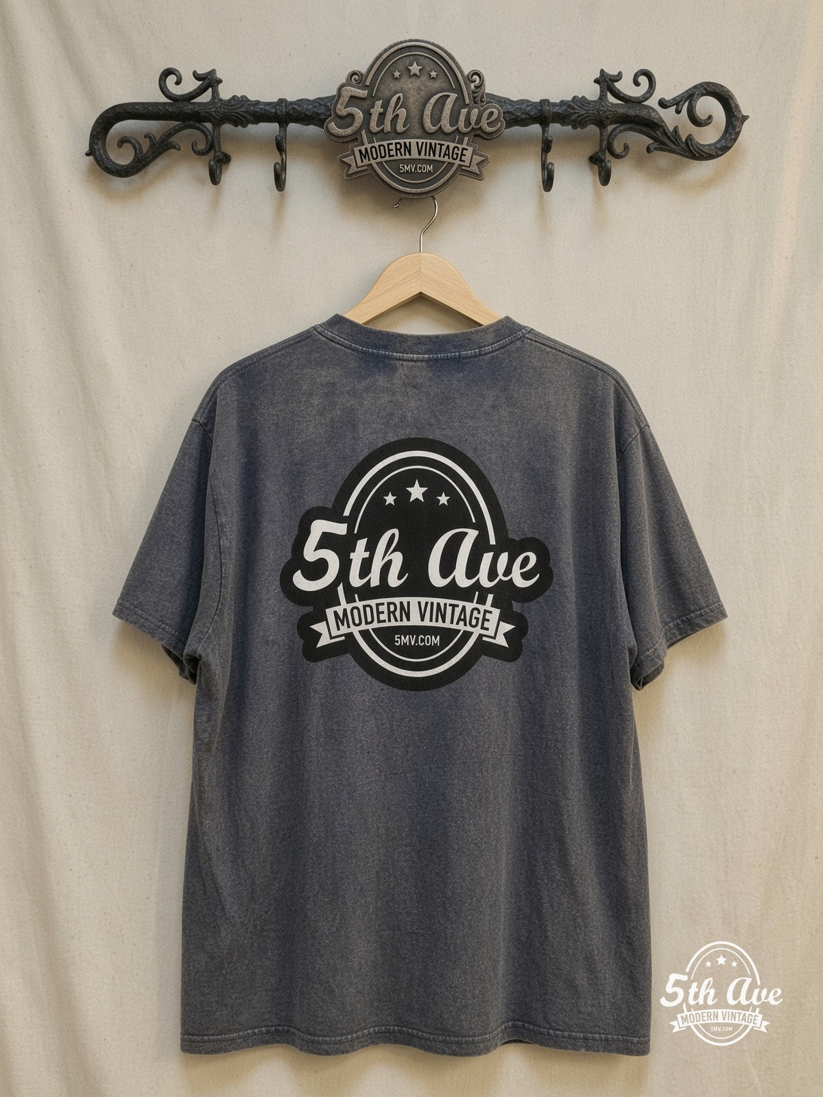 Nirvana – Aqua Logo High-Contrast Trio – Vintage Band T-Shirt — back on locked cream ornate 5th Ave rack