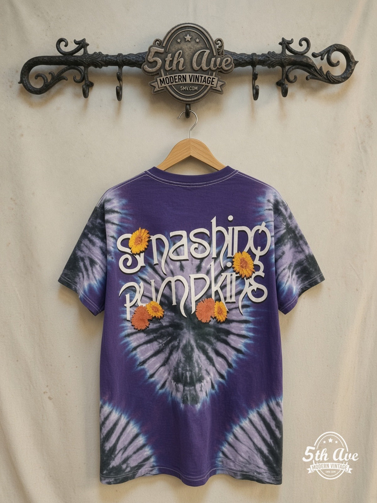 Smashing Pumpkins The Infinite Sadness Tour Tie Dye Single Stitch graphic tee in purple, back view on a display rack