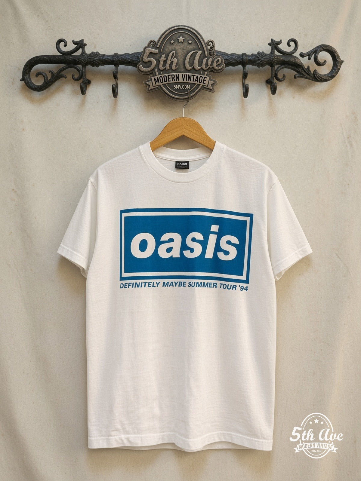 Oasis – Liam and Noel Gallagher – Vintage Band T-Shirt — back on locked cream ornate 5th Ave rack