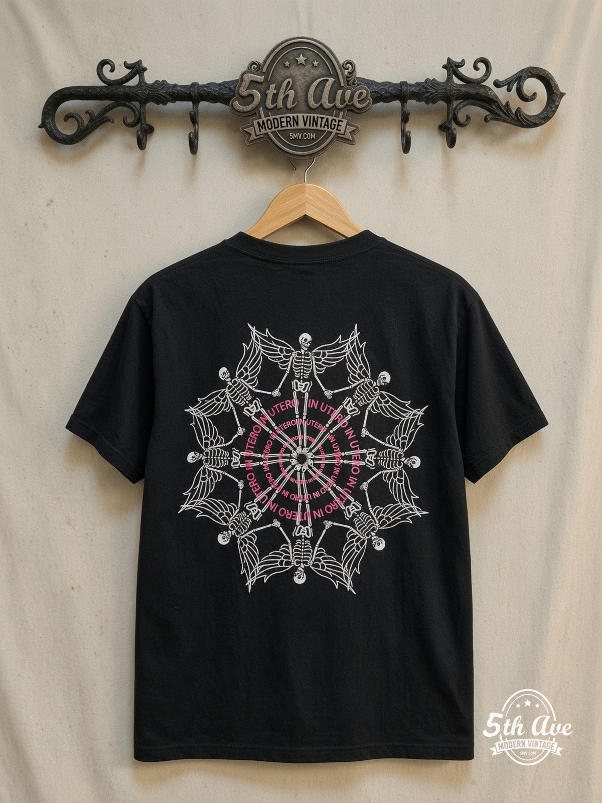 Nirvana – In Utero Tracklist Winged Skeleton – Vintage Band T-Shirt — back on locked cream ornate 5th Ave rack