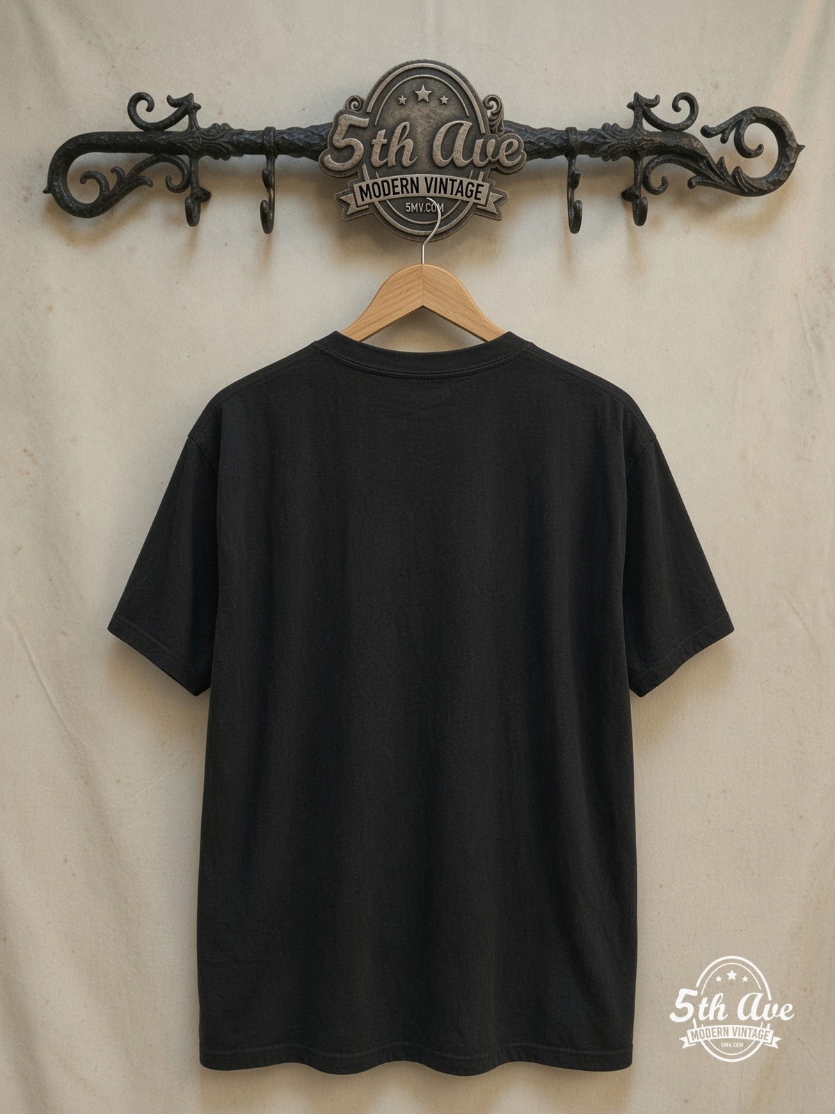 Bruce Springsteen – Vintage Band T-Shirt — back on locked cream ornate 5th Ave rack