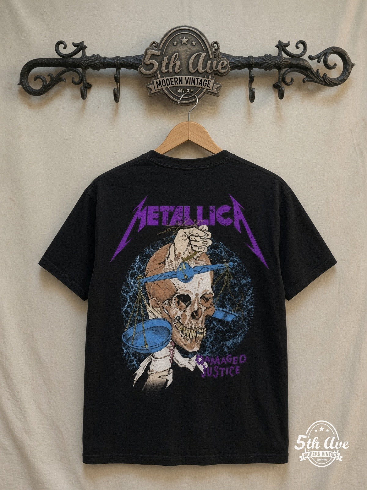 Metallica – Damaged Justice Skull Scales – Vintage Band T-Shirt — back on locked cream ornate 5th Ave rack