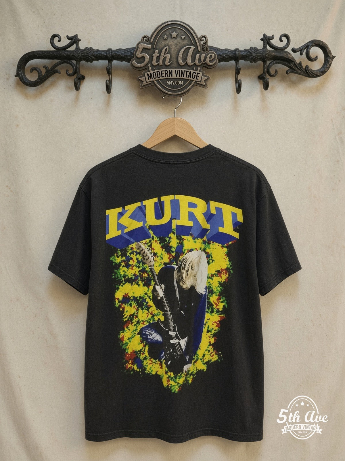 Nirvana – Kurt 3D Lettering Blue Eyes Guitar Memorial – Vintage Band T-Shirt — back on locked cream ornate 5th Ave rack