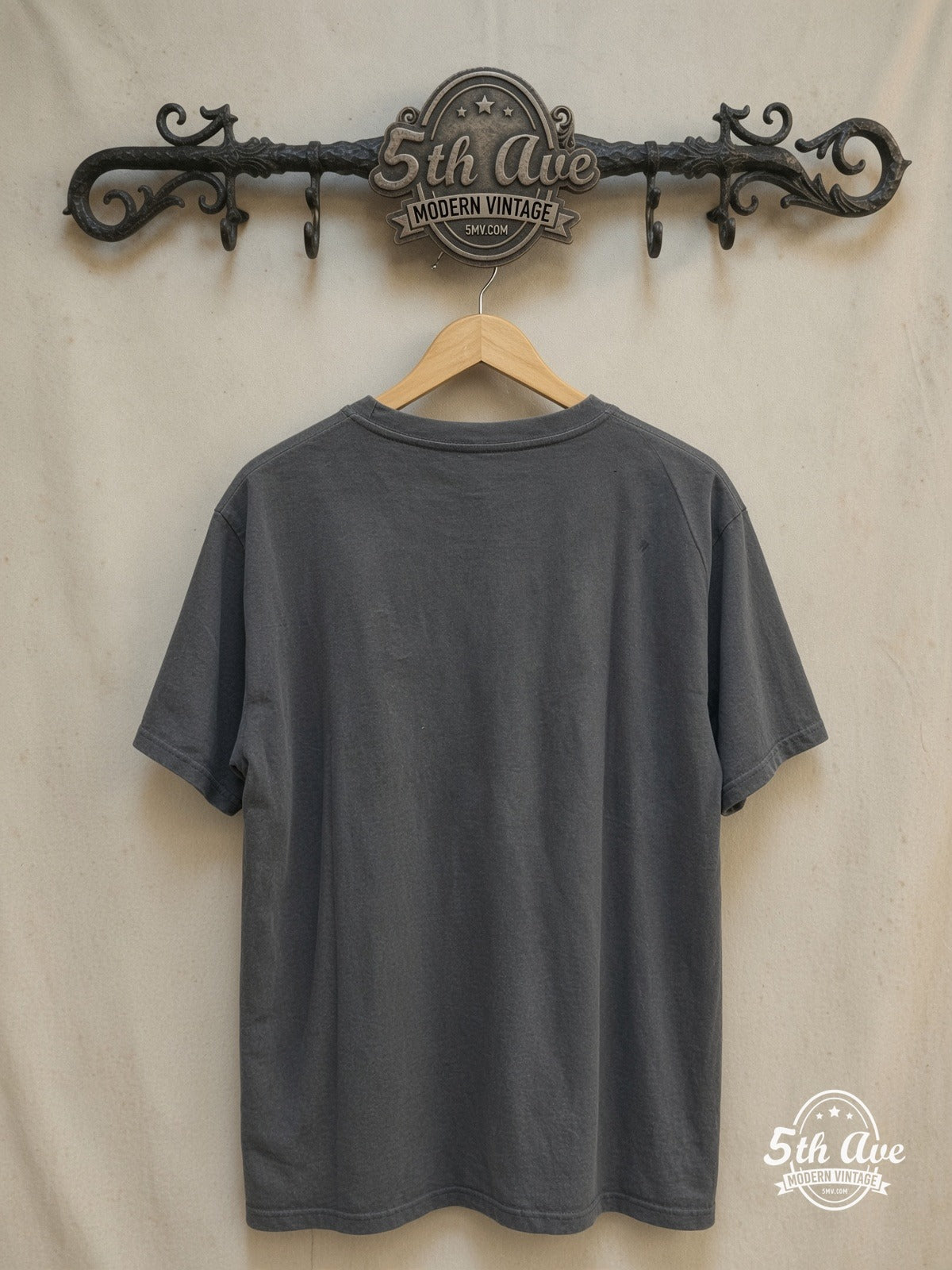 Nirvana – Kurt Cobain Cross-Eyes Yellow Circle Portrait – Vintage Band T-Shirt — back on locked cream ornate 5th Ave rack