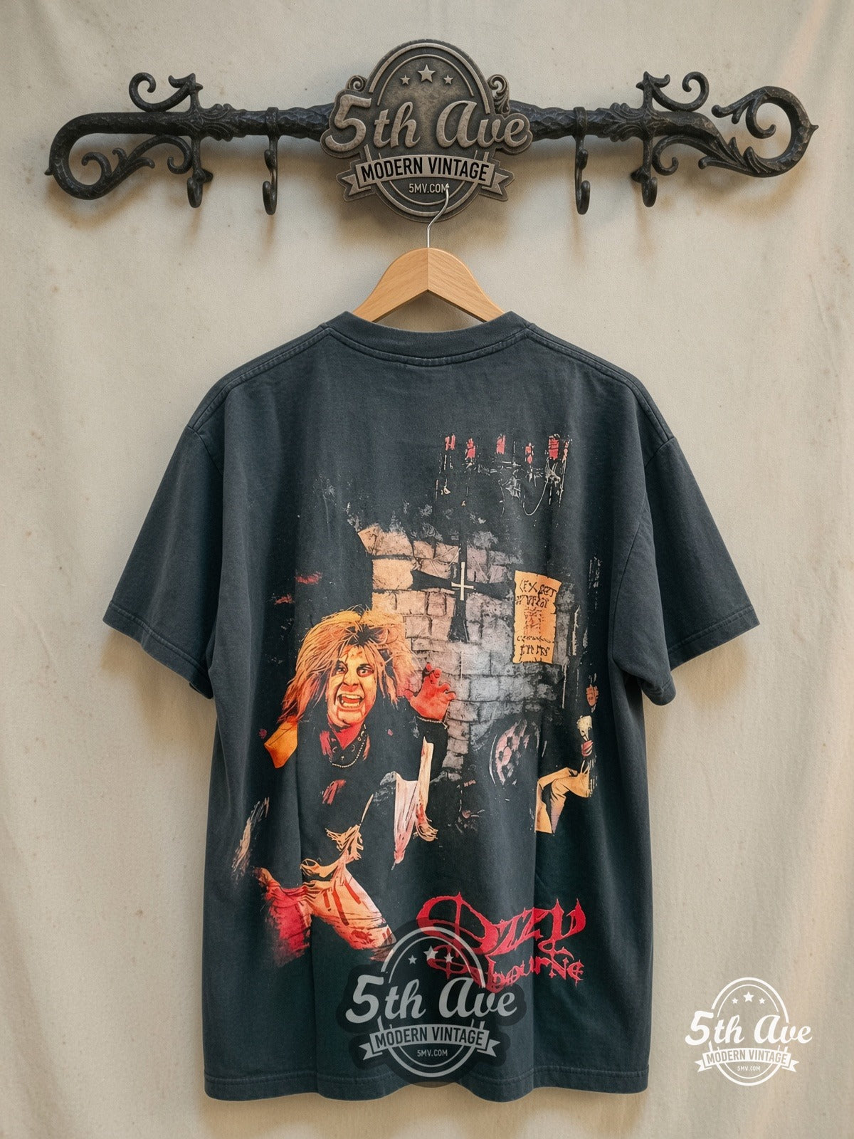 Ozzy Osbourne – Bark at the Moon – Vintage Band T-Shirt — back on locked cream ornate 5th Ave rack