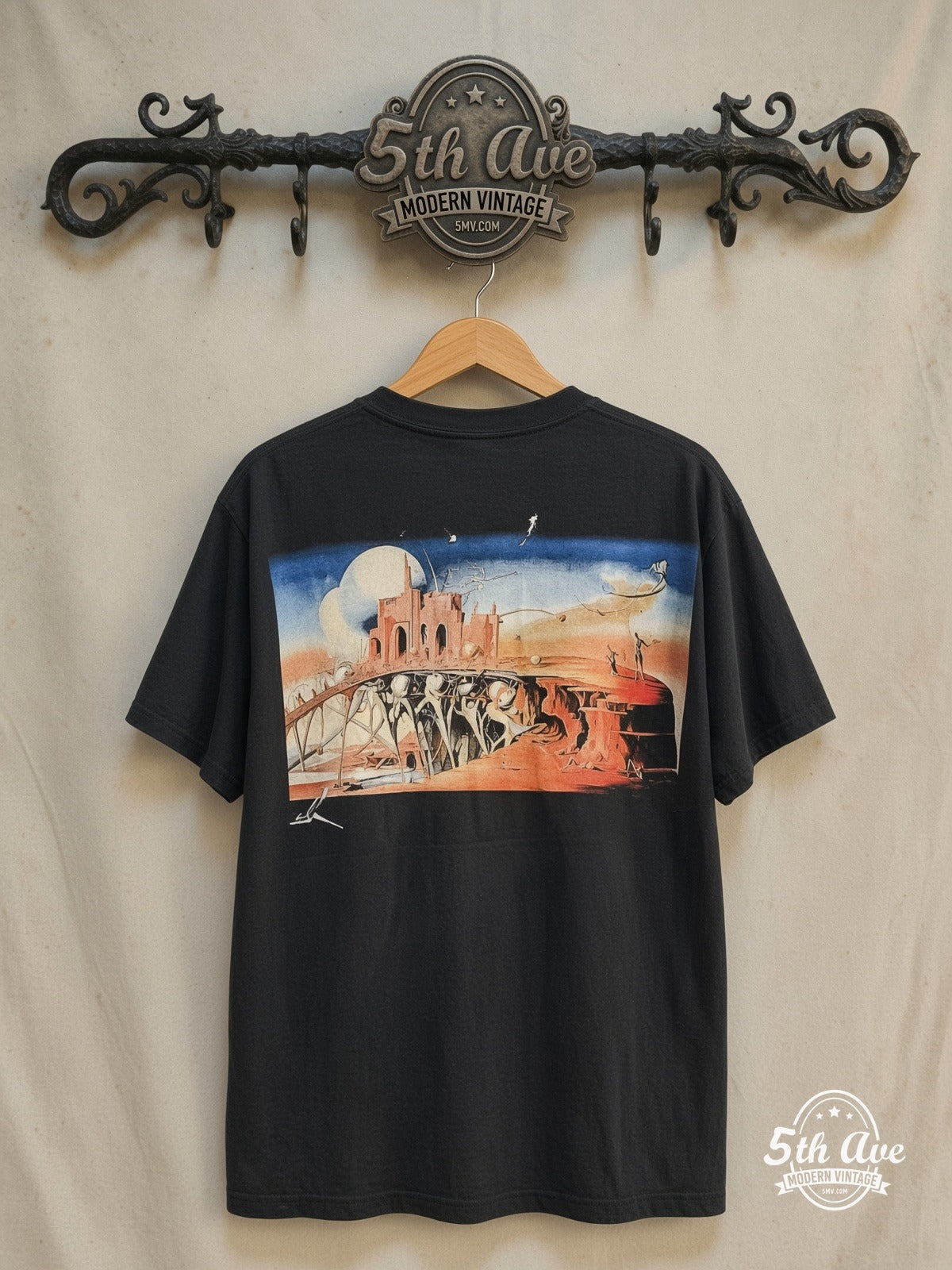 Salvador Dalí – Avida Dollars – Vintage Graphic Tee — back on locked cream ornate 5th Ave rack
