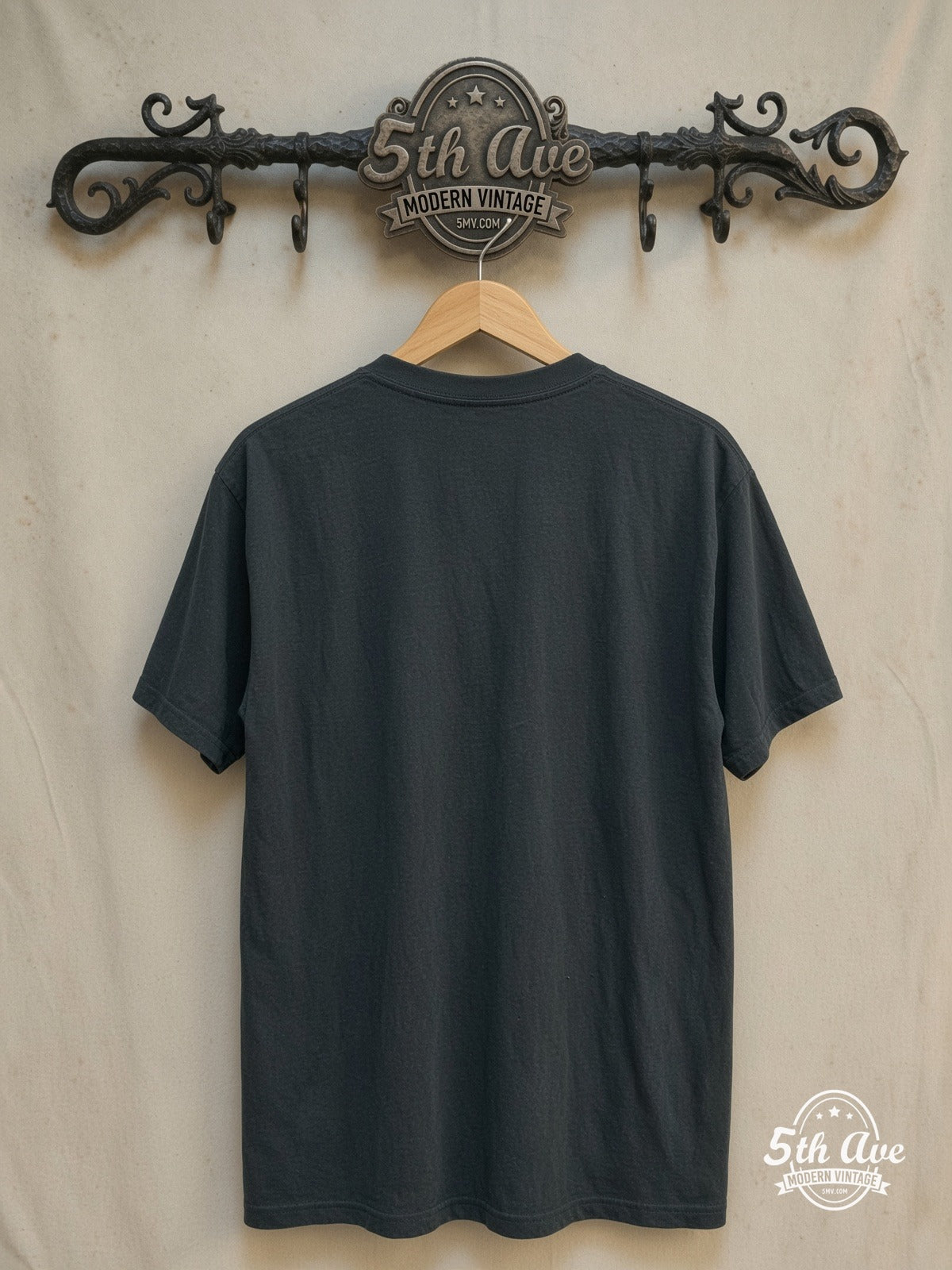 Nirvana – In Utero Weathered Teal Angel – Vintage Band T-Shirt — back on locked cream ornate 5th Ave rack