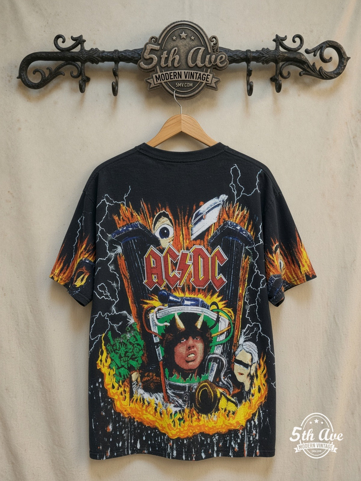 AC/DC – Thunderstruck Style: The Angus Young All-Over Print Single Stitch t sh – Vintage Band T-Shirt — back on locked cream ornate 5th Ave rack