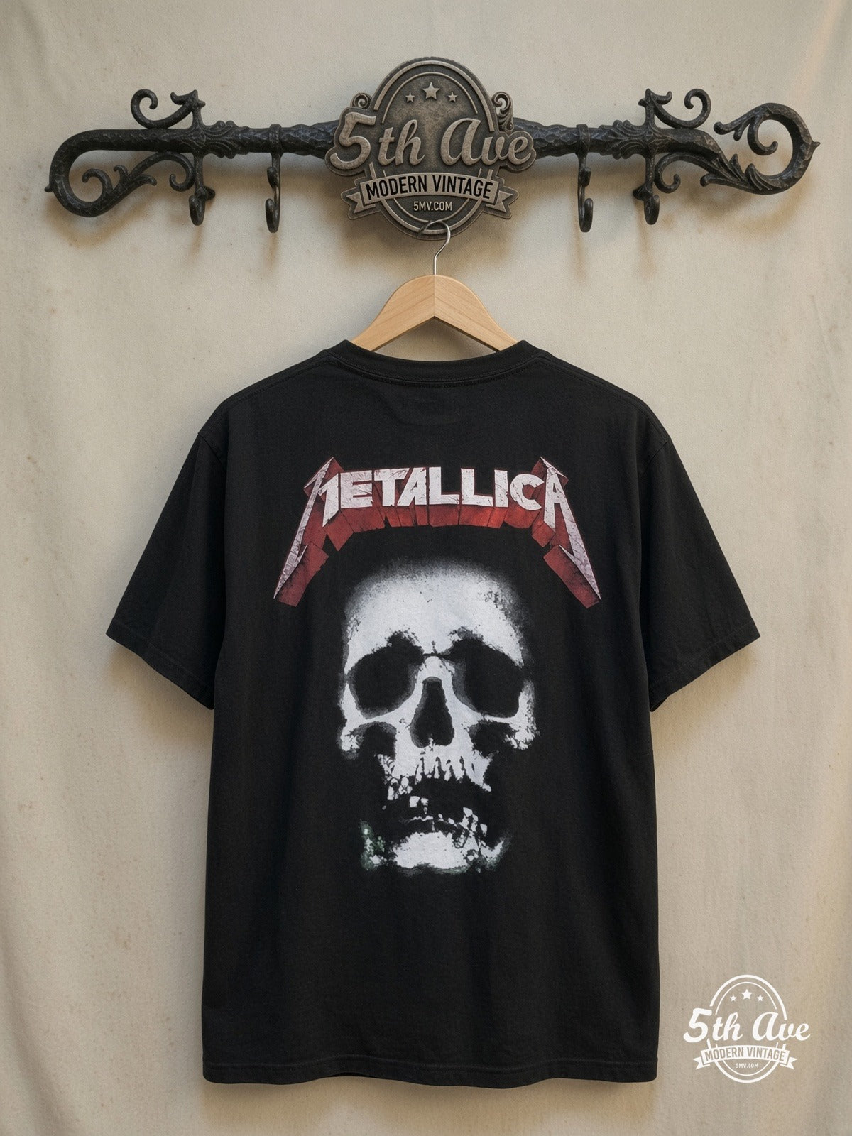 Metallica – 100% Cotton New Vintage Band T-Shirt – Vintage Band T-Shirt — back on locked cream ornate 5th Ave rack