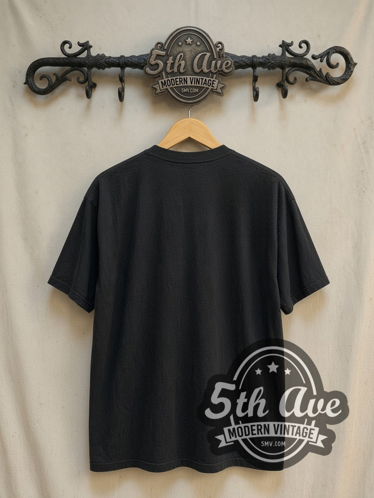 Joker Arthur Fleck vintage graphic t-shirt, back view on a display rack
