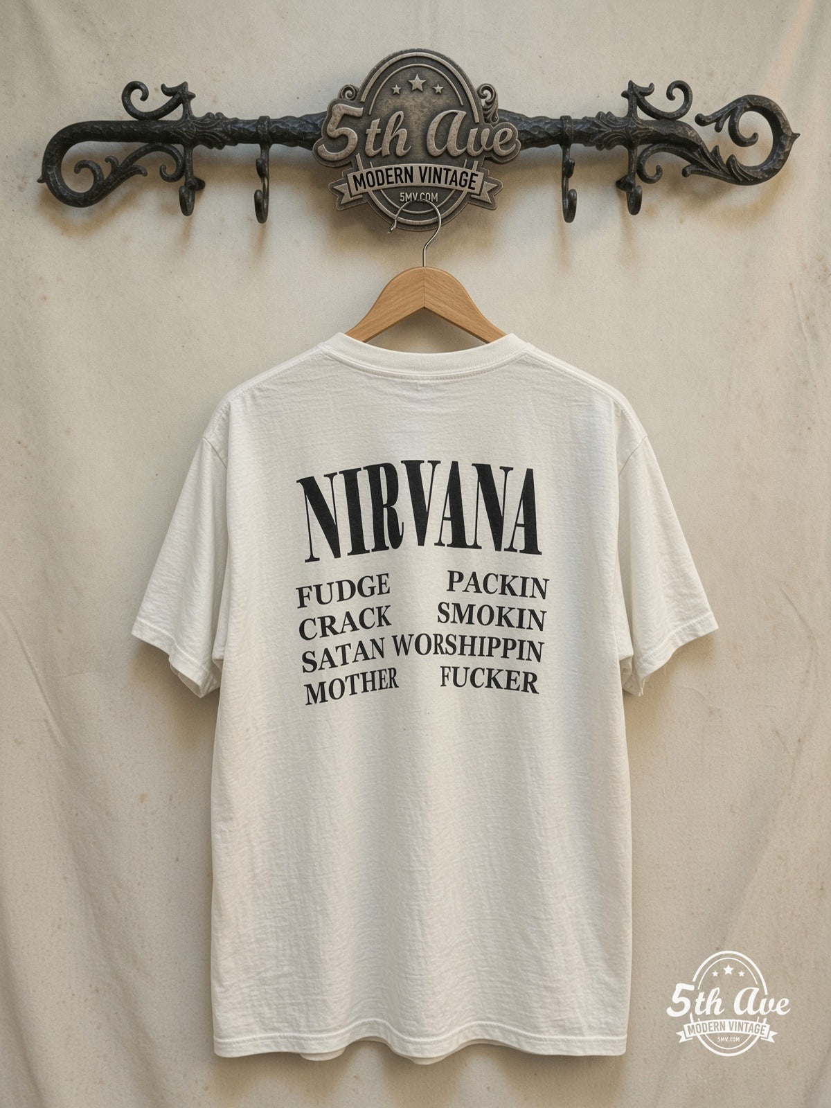 Kurt Cobain / Nirvana – Grunge Is Dead – All Over Print – Vintage Band T-Shirt — back on locked cream ornate 5th Ave rack