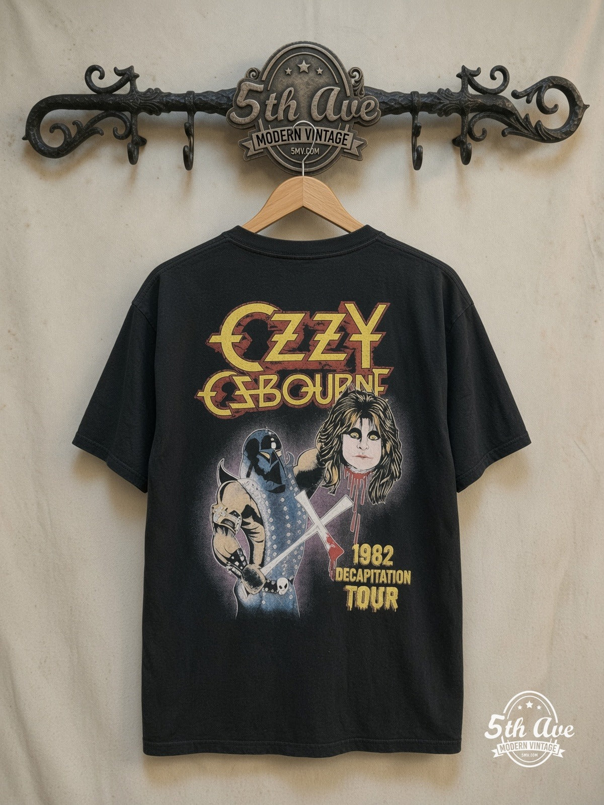 Ozzy Osbourne – 1982 Decapitation Tour – Vintage Band T-Shirt — back on locked cream ornate 5th Ave rack